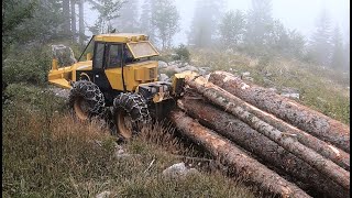 Skidder Ecotrac skidding big logs on rocky Mountain [upl. by Nosmirc188]