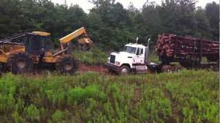 Skidder Dragging a Stuck Log Truck [upl. by Dana]