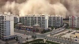 Huge sandstorm engulfs city in China [upl. by Nirroc]